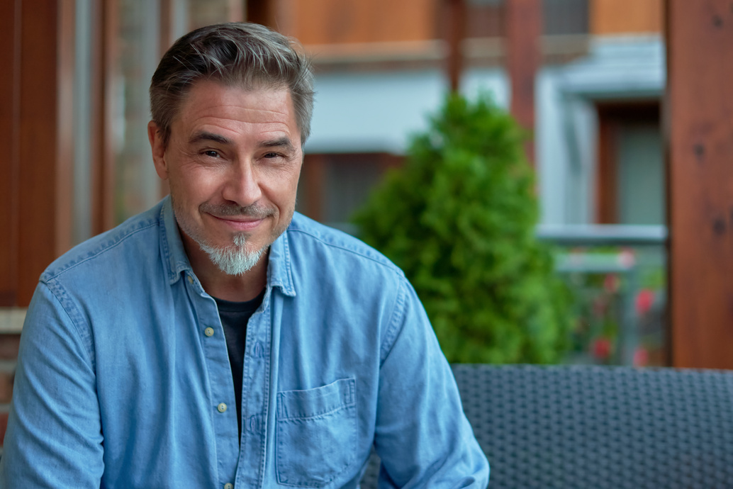 Portrait of happy smiling mid adult man